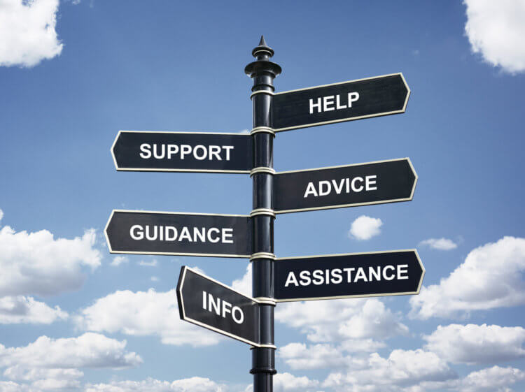 Signpost with directions to Help, support, advice, guidance, assistance and info.